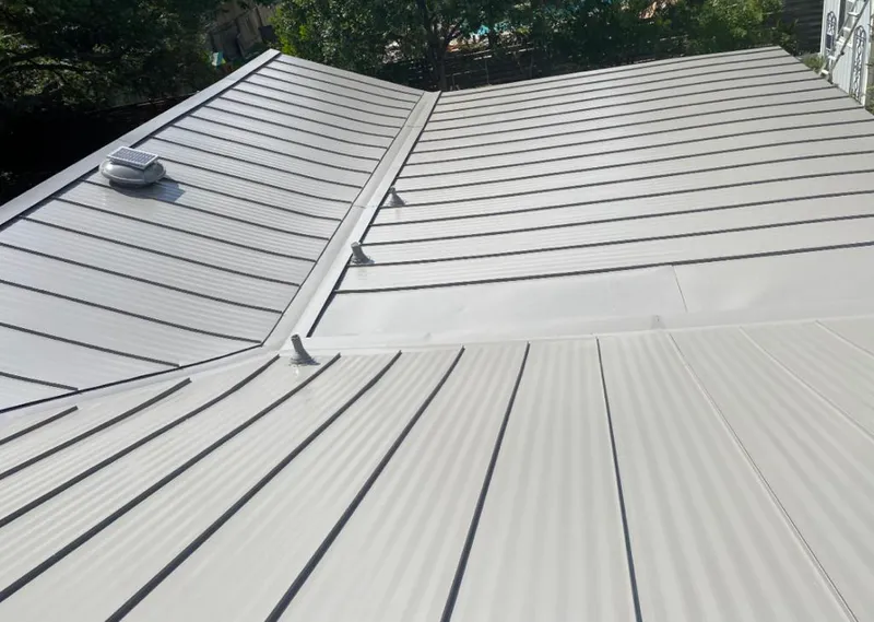 Solar attic fan installed on a metal roof for Roof Ventilation in Mount Joy